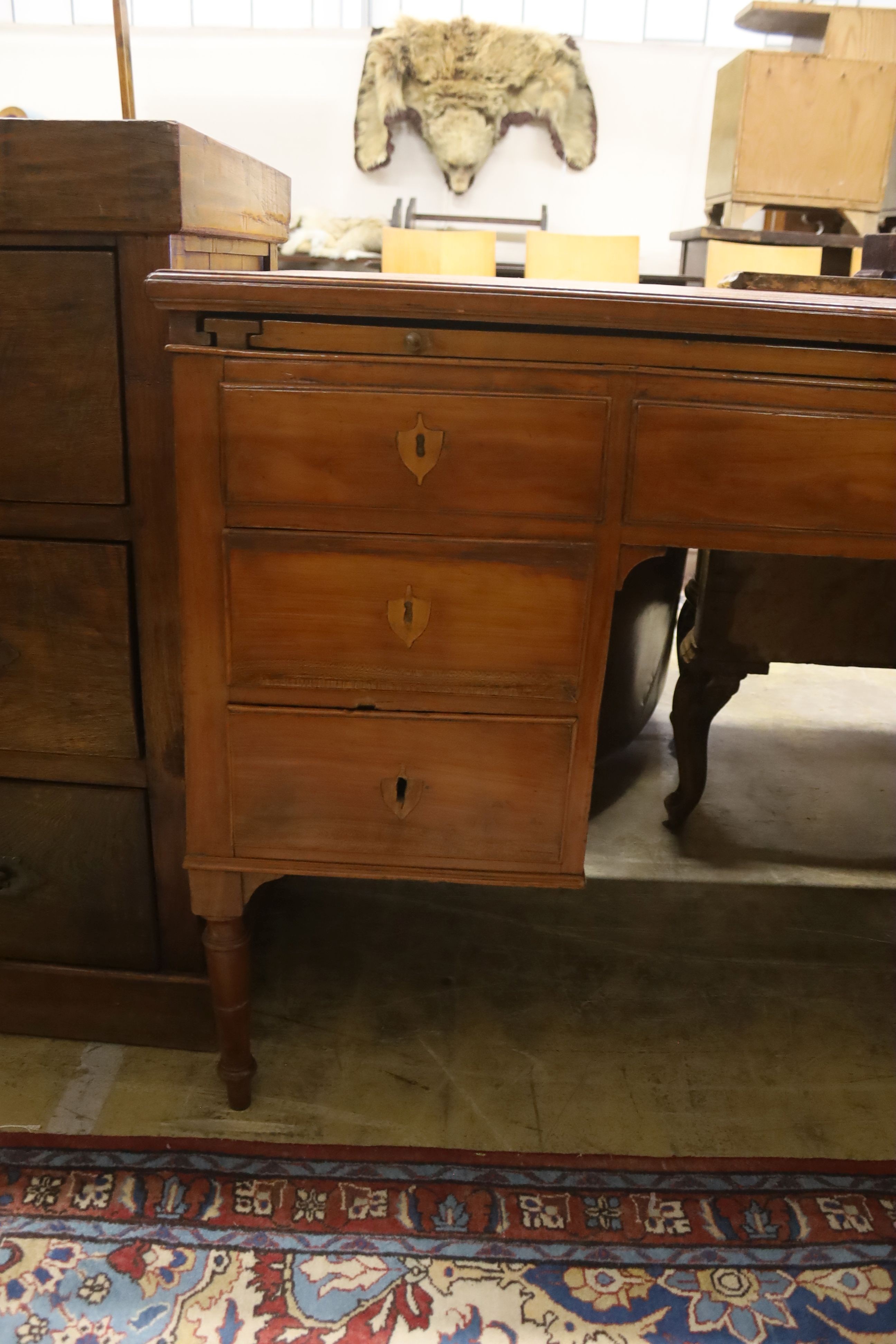 A late 19th/ early 20th century Italian walnut kneehole desk, width 122cm, depth 60cm, height 79cm